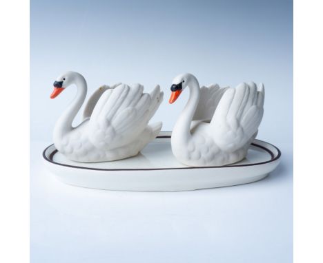 This set includes two porcelain swans and a porcelain tray. Tray measures 7"L, swans measure 2.5"H. Goebel backstamp. Issued: