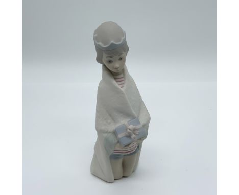 This retired Lladro porcelain figurine, "King Melchior" (item number 01014673), was sculpted by Juan Huerta and first issued 