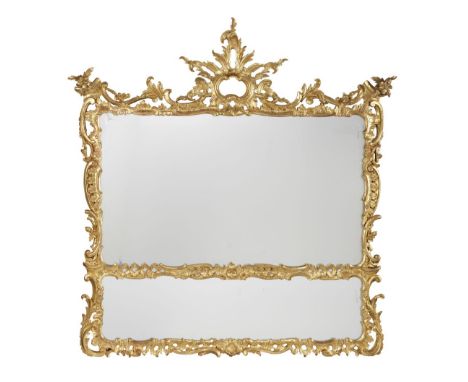 A 19TH CENTURY CARVED GILTWOOD OVERMANTEL MIRRORIn the George II styleThe split rectangular plate within a profusely carved s