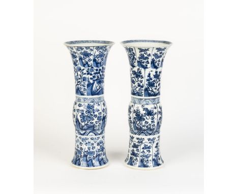 A MATCHED PAIR OF CHINESE BLUE AND WHITE GU VASESKangxi, 17th-18th centuryDouble circle and leaf marks, 49cm high x 20.5cm di