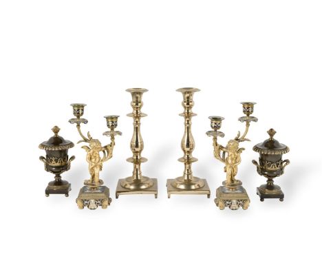 A PAIR OF FRENCH GILT AND CHAMPLEVE ENAMEL CANDELABRA19th centuryEach fashioned as a cherub holding aloft two sconces and dri