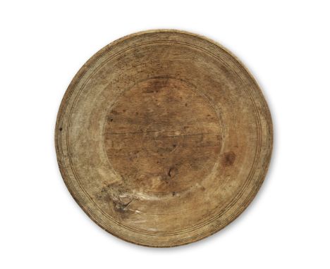 A LARGE TURNED ASH SHALLOW BOWL19th century With ring turned decoration, 53cm wide, 50cm deep, 7.5cm high (20 1/2in wide, 19 