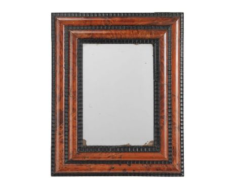 A RED STAINED TORTOISESHELL AND EBONY MIRROR19th century The later rectangular plate within a moulded frame with ripple mould