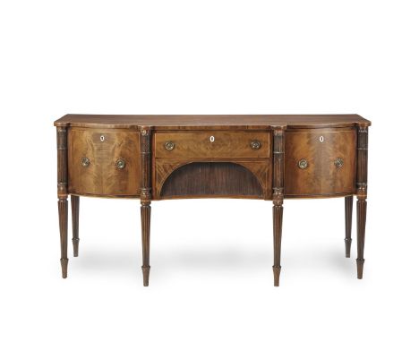 A GEORGE III MAHOGANY AND INLAID STEPPED FRONT SIDEBOARDThe top with line inlay border above frieze drawer with cupboard belo