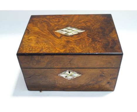 A Victorian burr walnut  and mother of pearl inlaid vanity box, with fully fitted interior containing concealed mirror, silve