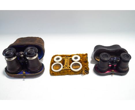 A pair of double lensed mother of pearl and gilt metal adjustable glasses, a pair of W.Ecker field glasses in case and a pair