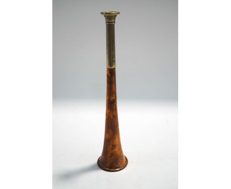 A copper and nickel hunting horn stamped Swaine and Adeney, London, Proprietors of Kohler & Sons, 24cm long