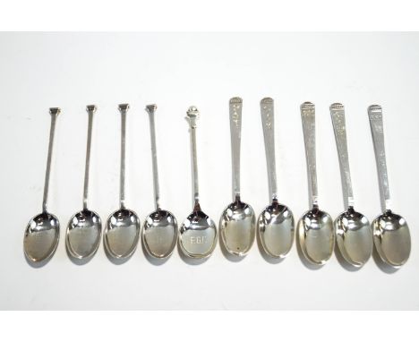 A silver coffee spoon with a golf ball finial; with a set of five silver coffee spoons; and a set of four silver coffee spoon