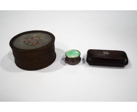 An enamel and silver pill box, a round gilt metal box with embroidered lid, 8.25cm diameter and a rosewood wood snuff box