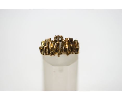 A 9 carat gold textured ring, finger size K, 3.7 g gross