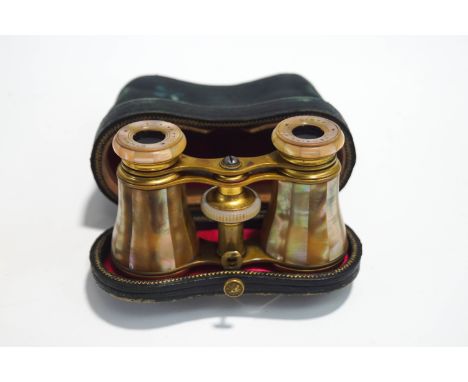 A pair of late 19th/early 20th century French mother of pearl opera glasses, made by Lemaire of Paris, cased