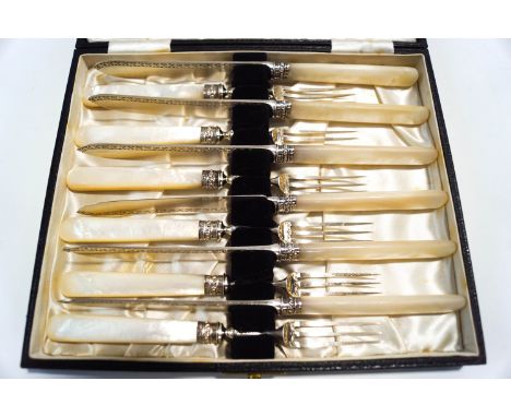 A set of six late Victorian dessert knives and forks, by Mappin Brothers, Sheffield 1898, the silver blades and tines to moth