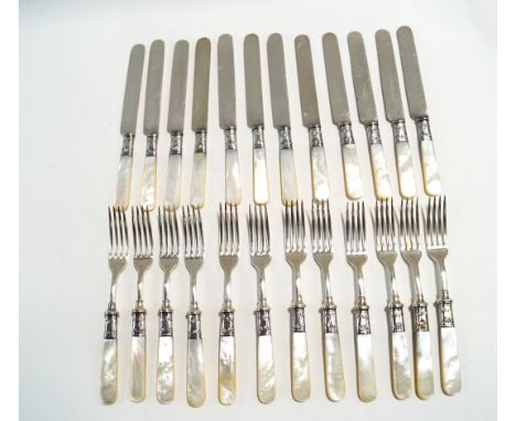  A set of twelve mother of pearl handled dessert knives and forks