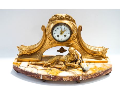 An Art Deco style marble mantel clock with later gilt paint, the painted dial signed H Peschet, Bernay, the base modelled wit