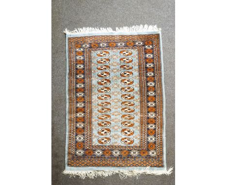 A Bokhara rug with elephant's foot pattern on a light blue field, 137cm x 96cm
