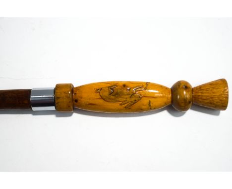 A Scottish shafted walking stick, the handle carved with rabbits