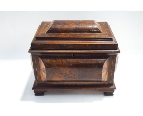 A 19th century walnut work box, the cushion shaped sides and top with parquetry inlay, raised on ogee bracket feet, 33cm wide