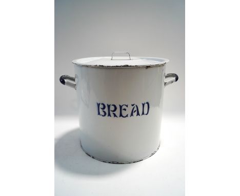 A vintage enamel bread bin and cover, 34cm high
