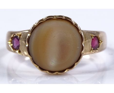 An 18ct gold mother-of-pearl and ruby ring, setting height 12mm, size S, 5.1g