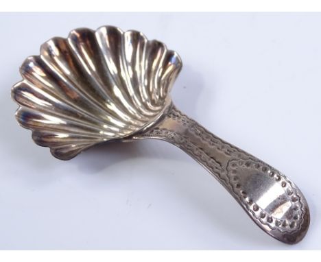 A Georgian silver caddy spoon, with shell design bowl and engine turned handle, by Hester Bateman, hallmarks London 1788, len