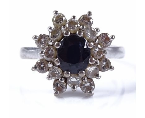 An 18ct white gold sapphire and diamond cluster ring, setting height 14.4mm, size M, 6g