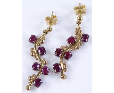 A pair of unmarked gold naturalistic ruby set pendant earrings, height excluding fitting 34.9mm, 8.1g total