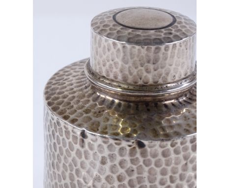 A cylindrical silver tea caddy, with planished decoration, by Walker &amp; Hall, hallmarks Chester 1907, height 9cm, 3oz