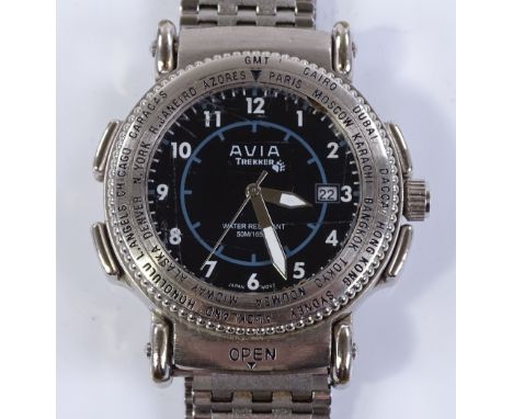 An Avia Trekker travelling wristwatch, stainless steel case with rotating timezone bezel and flip up face with built in compa
