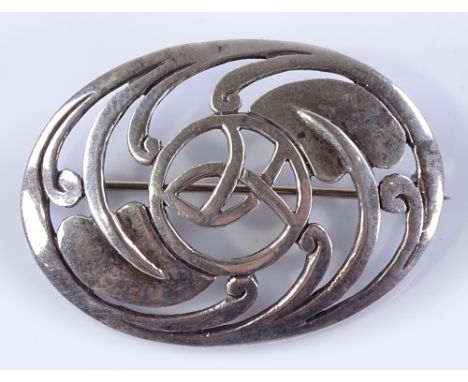 An Arts and Crafts sterling silver brooch, with stylised leaf decoration, maker's marks K and SH, length 40.1mm, 8.5g