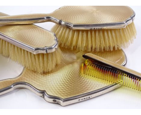 A 4-piece silver and yellow enamel dressing table set, by William Comyns &amp; Sons Ltd, hallmarks London 1935