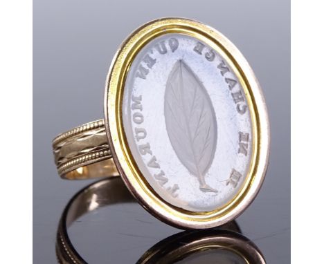 An unmarked gold intaglio seal ring, with leaf design and "Je Ne Change Qu'en Mourant" motto, setting height 21mm, size P, 5g