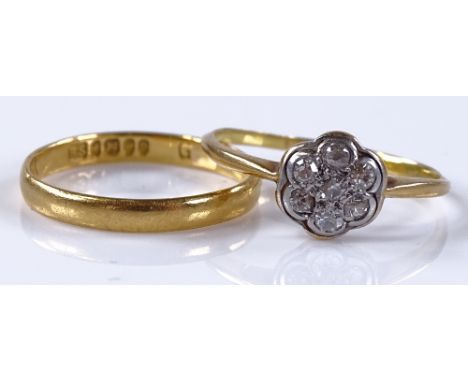 An 18ct diamond cluster flowerhead ring, setting height 7.6mm, 1.6g, together with a 22ct gold wedding band, 1.5g, both size 