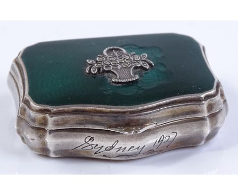 A small silver and green enamel pillbox / powder box, with marcasite set basket of flowers, by Cohen and Charles, import mark