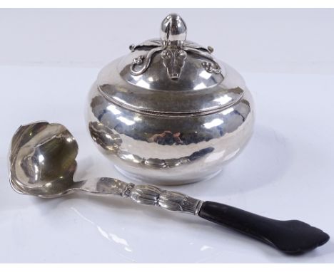 A Danish silver circular box, dated 1919, together with a Danish silver ladle with ebony handle, dated 1932 (2)