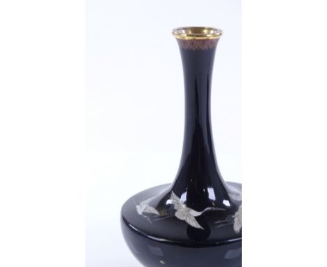 A Japanese black ground cloisonne enamel narrow necked vase, with stork designs, height 12cm