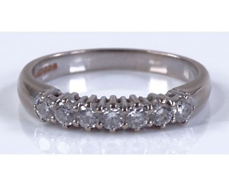 An 18ct white gold 7-stone diamond ring, setting height 3.6mm, size T, 5g