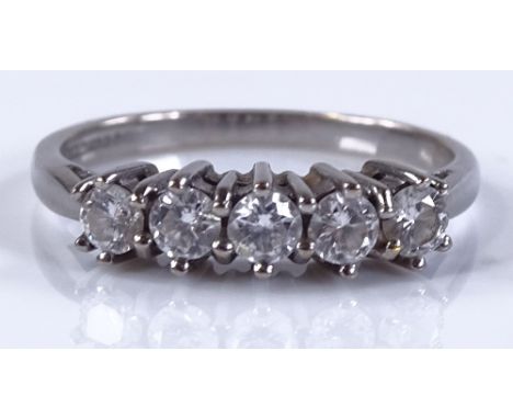 An 18ct white gold 5-stone diamond ring, total diamond content approx 0.55ct, setting height 4.4mm, size N, 2.9g