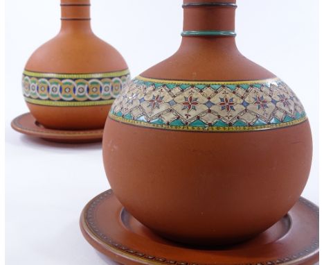 2 19th century terracotta water flagons and covers on stands, with hand painted geometric enamel bands, height 30cm