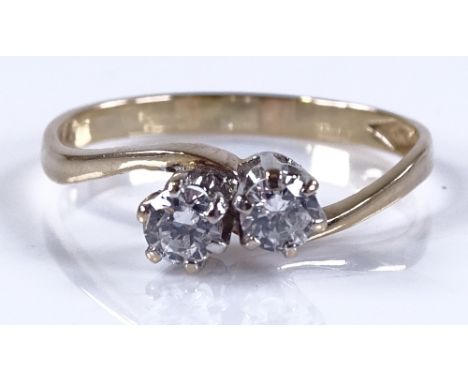 A 9ct gold 2-stone diamond crossover ring, total diamond content approx 0.3ct, size N, 1.4g