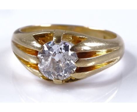 A large 1.29ct solitaire diamond gypsy ring, 18ct gold settings, setting height 10.2mm, size T, 9.1g (diamond chipped)