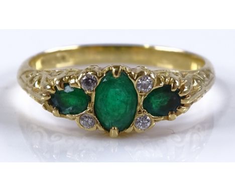 An 18ct gold emerald and diamond ring, total emerald content approx 0.76cts, total diamond content approx 0.06cts, setting he