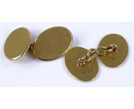 A pair of 18ct gold engine turned oval cufflinks, maker's marks EAP, hallmarks Birmingham 1929, height 18.8mm, 13.2g total