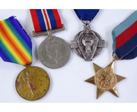 First and Second War Period service medals, and a silver Masonic medal