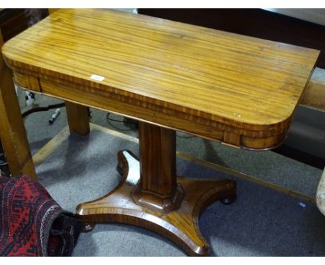 A 19th century satinwood fold over card table, on canted centre column and shaped platform base, width 36"