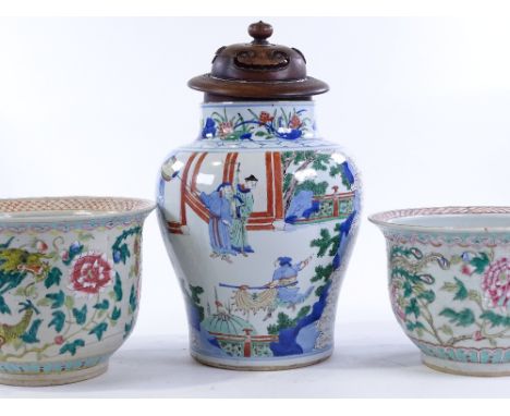 A Chinese porcelain vase, with painted warriors and hardwood cover, height 40cm, together with a pair of Chinese jardinieres 