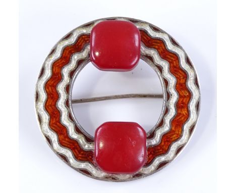 An Art Deco silver and coloured enamel circular brooch, set with 2 pink stones, diameter 36.6mm, 11g