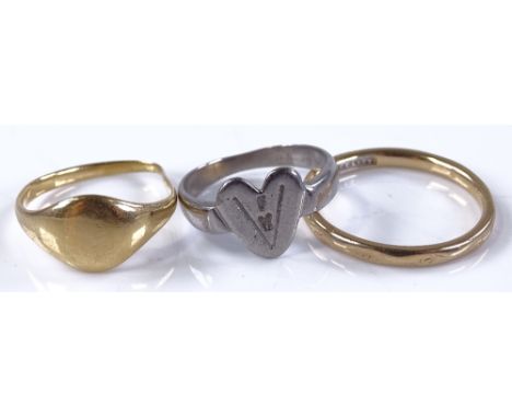 A 9ct gold wedding band, size R, 2.4g, an unmarked gold high carat signet ring, 3.7g, and an unmarked white metal heart ring,