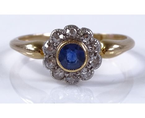 An 18ct gold sapphire and diamond cluster flowerhead ring, setting height 8.8mm, size N, 3g