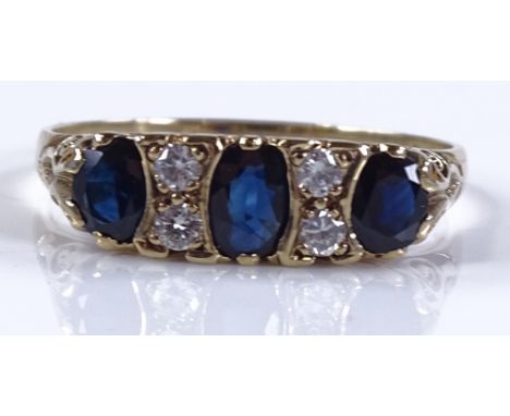 A 9ct gold 7-stone sapphire and diamond ring, scroll engraved bridge, setting height 6.2mm, size W, 3g