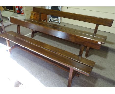 A pair of mahogany Arts and Crafts design bench seats, length 7'7"